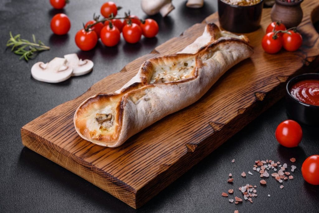 Delicious fresh street pizza with chicken, mushrooms and cheese