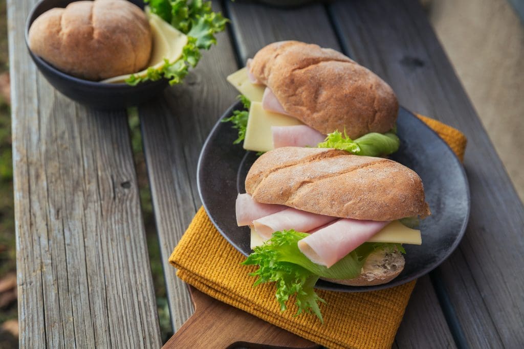 Ciabatta baguette sandwiches with ham, cheese and lettuce