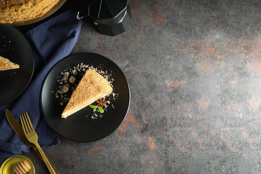 Concept of tasty dessert with honey cake, space for text