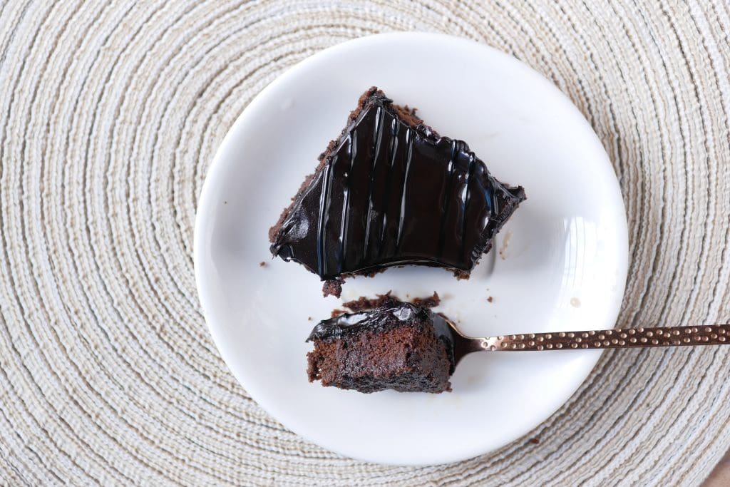 slice of brownie on plate on table