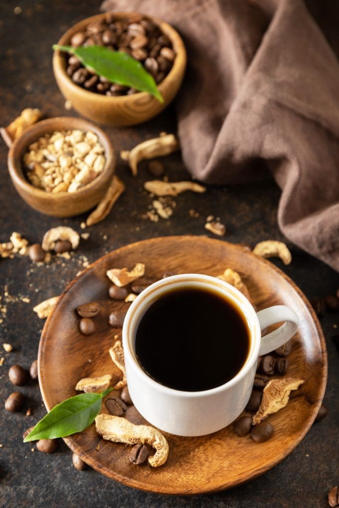 Mushroom coffee in a cup and coffee beans, trendy drink.