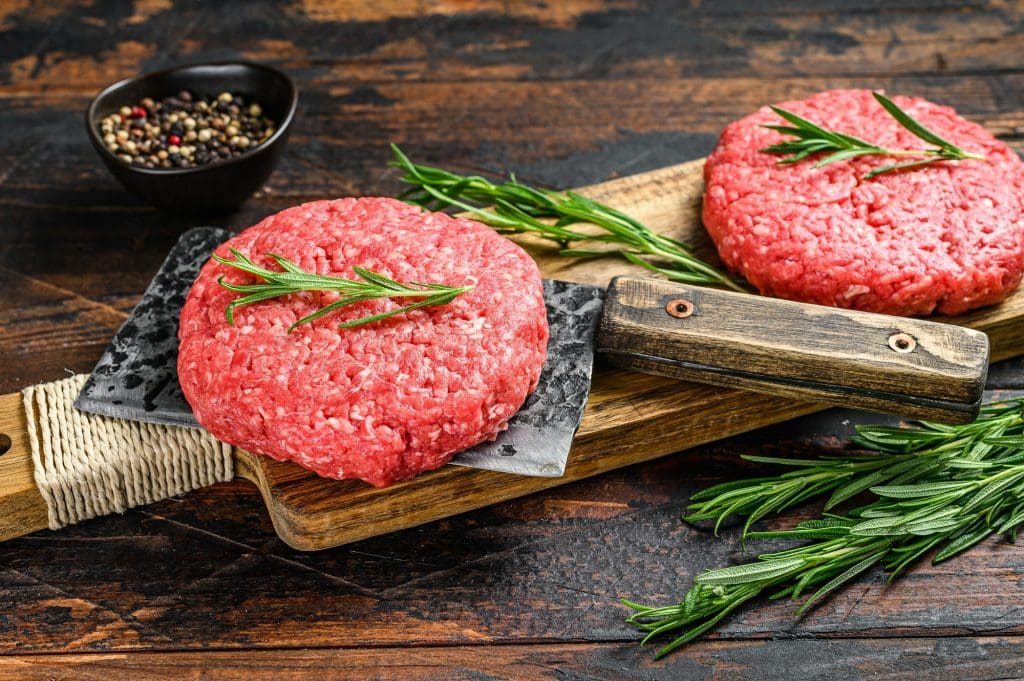 Ground raw meat patties. Meat cutlet ready to cook. Farm organic meat.