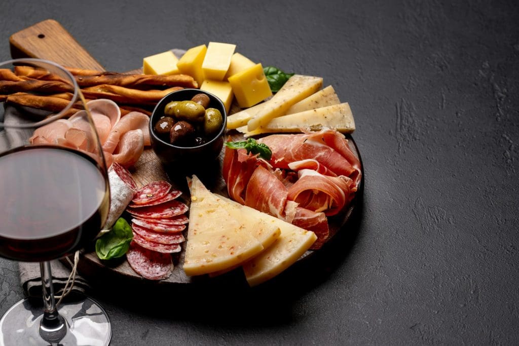 Antipasto board with various meat and cheese snacks
