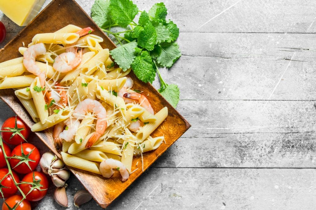 Pasta with shrimp,garlic, tomatoes and cheese.