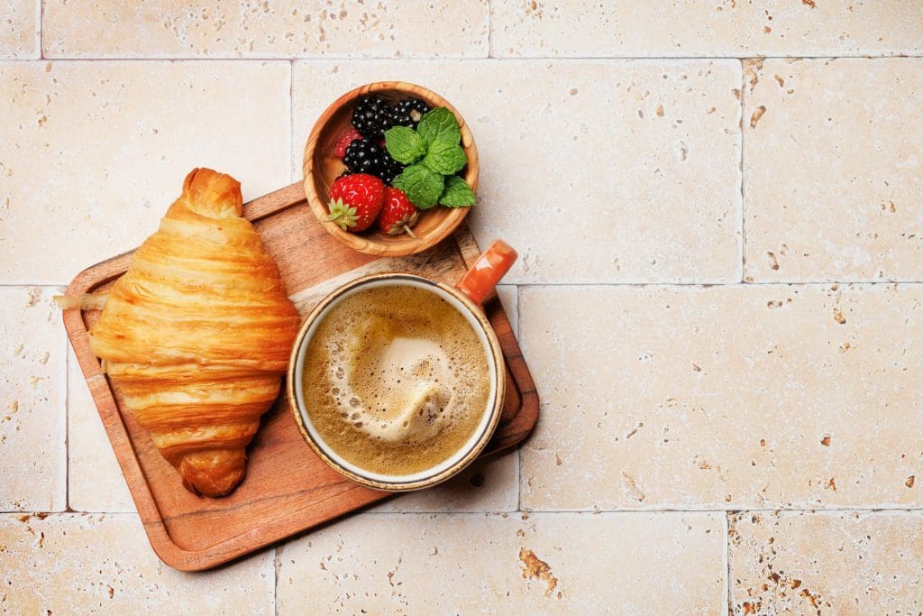 Coffee cup and croissant