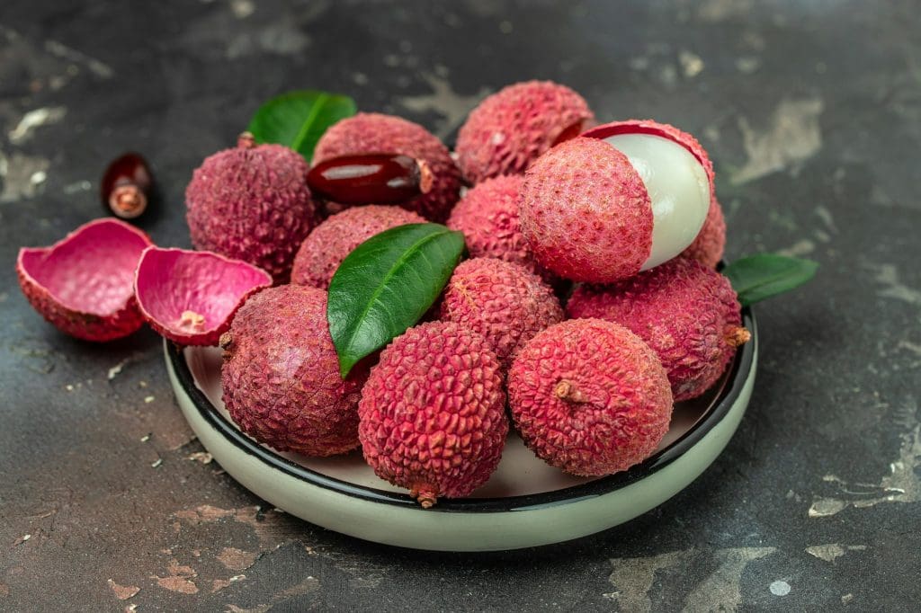 fresh ripe lychee tropical fruit Thailand on a dark background, Food background. Close up
