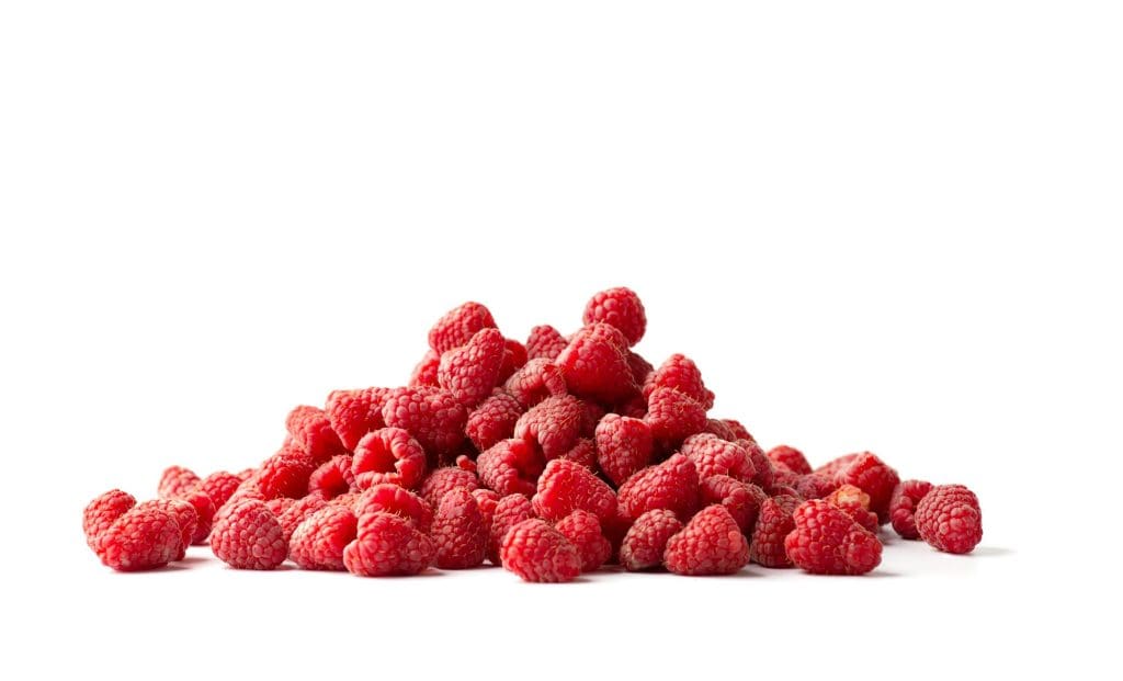 Pile of ripe rasberries isolated on white background